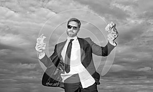 millionaire man with money on sky background. millionaire man with money outdoor photo