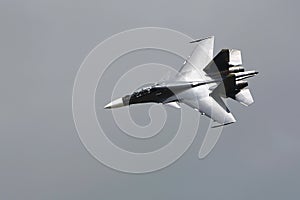 Millitary supersonic fighter, on the gray sky