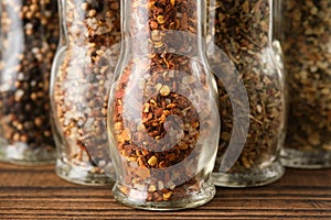 Mills of aromatic spices and herbs. Several grinders of seasoning. Condiments for cooking