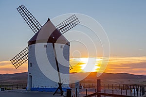 Mills in the town of Consuegra. Landscape of several white windmills and brown windmills on the hill.