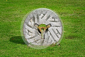 Millstone on the grass