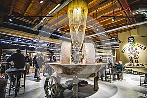 Millstones mill inside a modern restaurant in Fico Eataly World Bologna - Italy