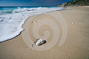 Milos beach near the Agios Nikitas village on Lefkada Ionian island, Greece. Evening sunset golden light