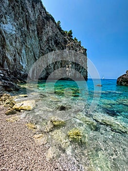 Milos beach with rock in the sea.