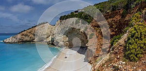 Milos beach between rocks in a sunny bay - 01