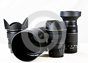 miltiple professional photography lenses together on white background