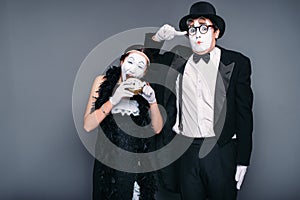 Mime actors performing, actress nibble alarm clock