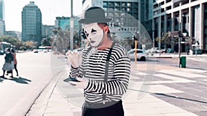 Mime, angry and problem with smartphone in city for technical glitch, error and network issue. Communication, technology