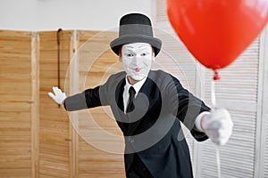 Mime artist with air balloon, comedy parody