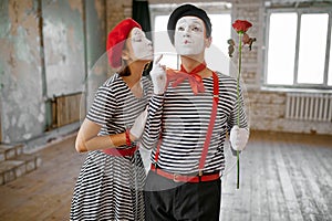 Mime artists with makeup, kissing scene, comedy