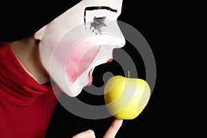 Mime biting an apple