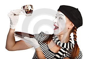 Mime comedian drinking coffee