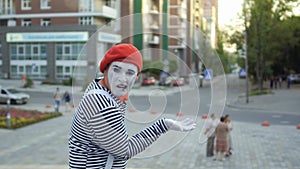Mime gesticulate hands and has fun on camera