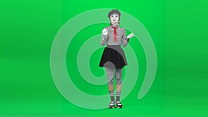 Mime girl is drinking something disgusting. Chroma key. Full length.