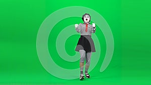 Mime girl is driving a car. Chroma key. Full length.