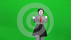 Mime girl is driving a car. Green screen, Chroma key.