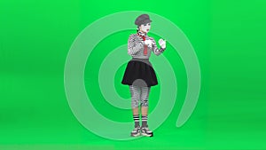 Mime girl evaluating something on tablet . Chroma key. Full length.