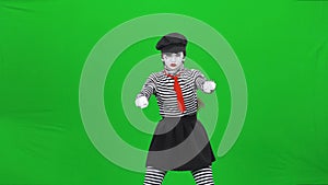 Mime girl getting on motorcycle and riding it, Chroma key.