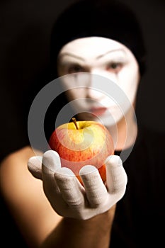 Mime with red apple