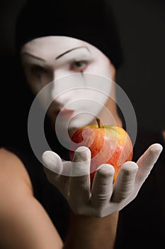 Mime with red apple