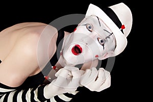Mime in striped gloves and white hat
