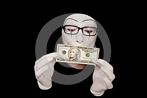 Mime in white gloves with 10 dollar denomination