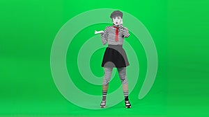 Mime woman is calling someone, talking. Chroma key. Full length.