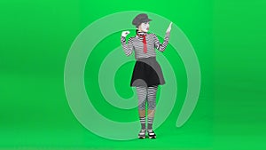 Mime woman is having call, talking. Chroma key. Full length.