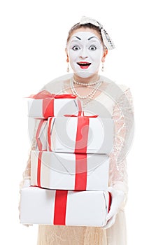 Mime woman holding many boxes of presents