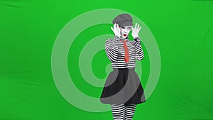 Mime young woman is smiling and seducing someone. Chroma key.