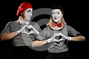 Mimes makes heart shapes