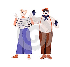 Mimes, street actors couple. French artists gesturing with hand. Woman and man performers with face makeup during dumb