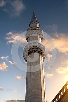 Minaret against the background of the sunset sky