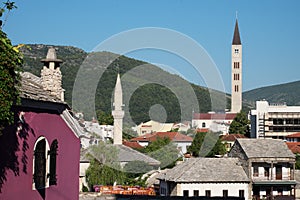 Minaret And Bell Tower In Mostar, Bosnia And Herzegovina