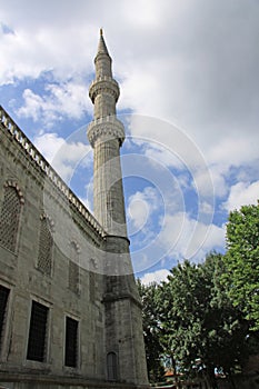 Minaret of The Blue Mosque Istanbul Turkey against a cloudy sky