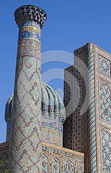 Minaret and dome, fragments of Sher-Dor madrasah in the architectural complex Registan, Samarkand