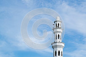 minaret and dome of Tengku Tengah Zaharah Mosque with blue sky background