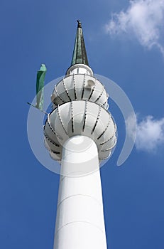 Minaret with green flag