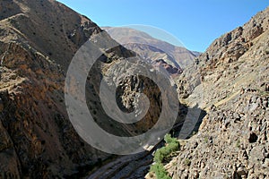 The Minaret of Jam, a UNESCO site in central Afghanistan. View fronm the top showing the dirt track access road. photo