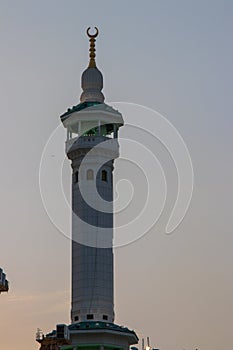 Minaret of Masjid Haram from Mecca - Saudi Arabia. Evening time. Iftar time in Ramadan.
