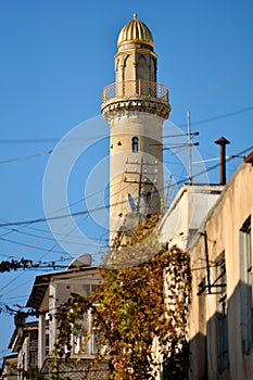 Minaret and messy telecoms cables in Baku, capital of Azerbaijan