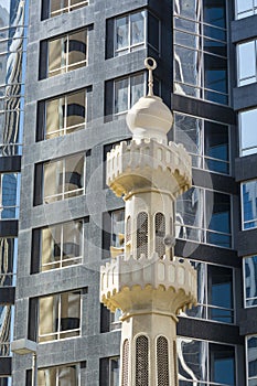 Minaret and modern facade