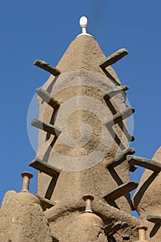 Minaret of a mosk made of mud in Mali photo