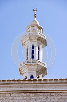 Minaret of the mosque against blue skies in Abu Dhabi, UAE