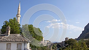 Minaret of Mosque of Mostarand bridge in Bosnia and Herzegovina