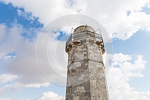 The minaret and the mosque roof of the Muslim part of the grave of the prophet Samuel on Mount of Joy near Jerusalem in Israel