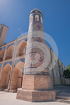 Minaret tower with blue mosaic tiles of Kukeldash Madrasah, Tashkent, Uzbekistan