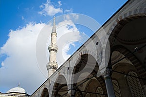 Minaret tower of Blue Mosque against blue sky in Istanbul