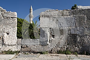 Minaret tower and castle wall in Kos city