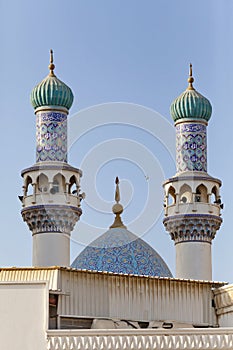 Minarets and dome of the mosque against blue skies